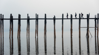 Three walkers Ubein bridge