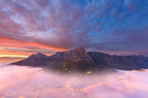 Panoramic of Table Mountain with the mist rolling in, amazing shot, sunrise, dramatic, beautiful, epic