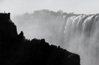 Tiny photographer amidst the mighty Vic Falls, Zambia