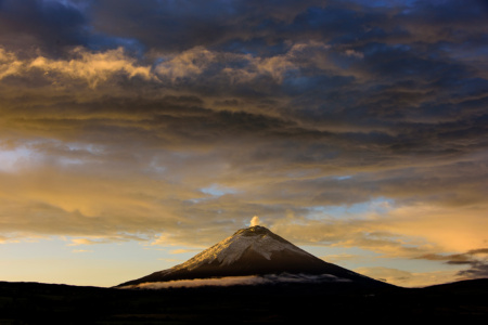 Cotapaxi Volcano sunrise with a smoking Cotapaxi Volcano, Ecuador