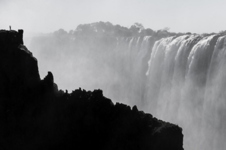 Mighty Vic Falls Tiny photographer amidst the mighty Vic Falls, Zambia