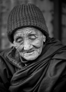 Elderly lady in a small town Elderly lady in a small town, Nepal